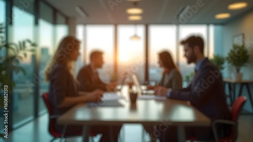 Blurred Business Team Meeting at Table in Modern Office