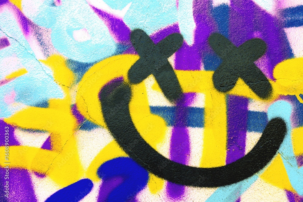 Naklejka premium Graffiti smiley face with X eyes in bold yellow, purple, blue. Retro 90s style, vibrant, cartoon graffiti art. Street art, urban design, modern 90s, creative banner, funky visuals.