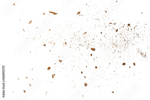 Crushed almond shells and powder crumbs on transparent background, resembling bread or spices like cinnamon. Perfect for overlays, food textures, and creative designs.
