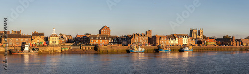 King's Lynn, England. Panoramic view from West Lynn at sunset with the Custom House, Purfleet tidal inlet, St Margaret's Cathedral towers, and Clifton House, an 18th-century merchant brick building