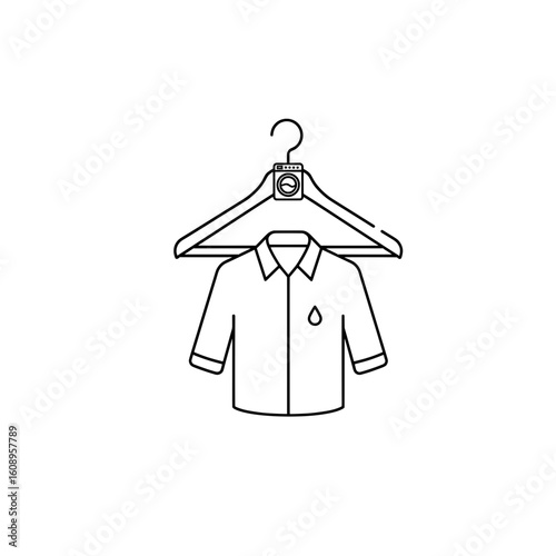  A shirt is hanging neatly on a hanger, representing wardrobe organization at home.