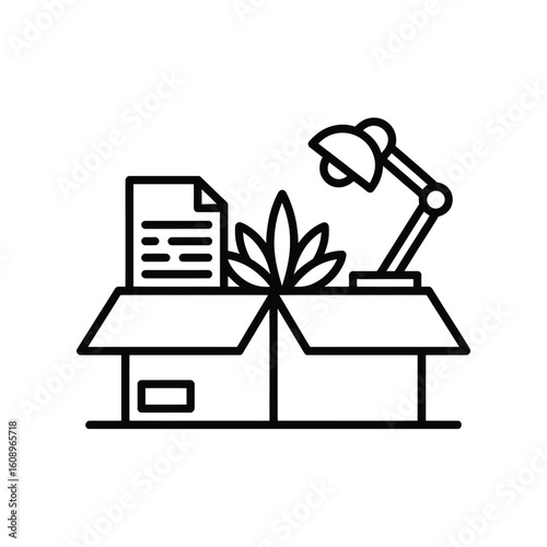 Moving office supplies and a plant into a cardboard box