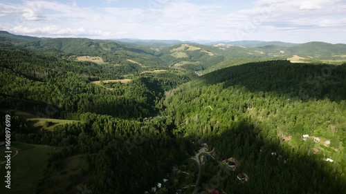 Beautiful summer Slovak nature. Large hills covered with forests and meadows. Drone video.