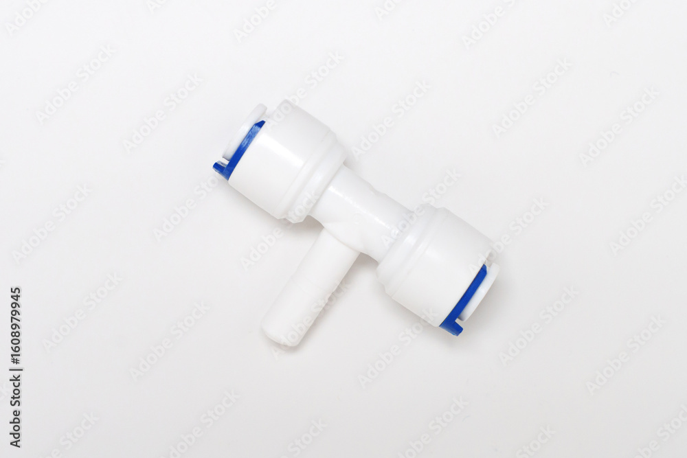 Naklejka premium Installing a plastic connector for plumbing in a workshop