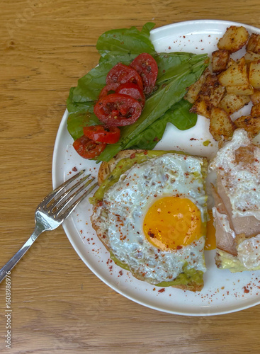 fried eggs with bacon and vegetables
