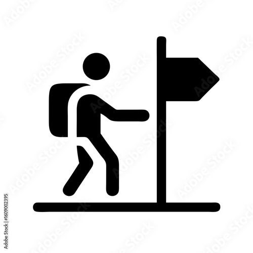 Hiking trail sign depicting hiker with backpack at trailhead, hiking trail sign. Black silhouette of person with rucksack at a hiking trail sign pointing direction forward.