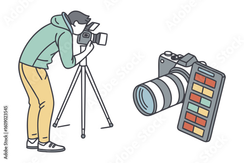 Creative professional capturing cinematic footage with a video camera on a tripod alongside a dslr