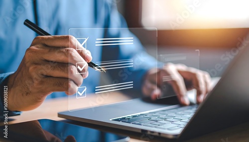 A person checking a digital checklist on a laptop.  Hands hold a pen, hovering over a transparent checklist displayed over a laptop keyboard.  Focus on the hands and the checklist