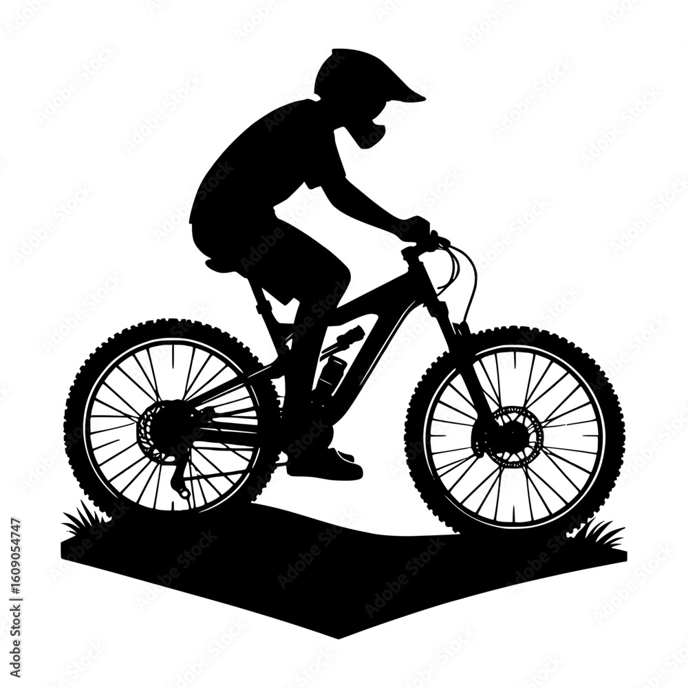 Fototapeta premium Silhouette of a mountain biker riding a full suspension bicycle