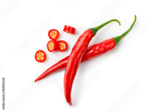 Foto Flat lay of Two Red chili peppers with sliced isolated on white.
