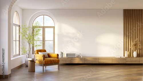 Photos A cozy and warm living room interior with natural light, wooden floors, and an armchair against warm white walls