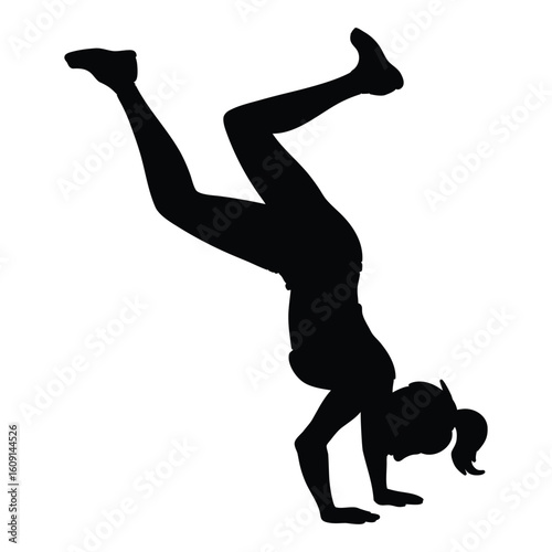 a black silhouette of a woman doing a handstand