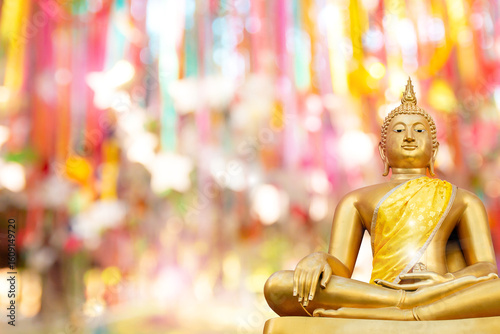 Beautiful golden buddha statue on natural background