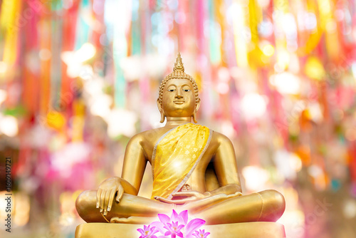 Beautiful golden buddha statue on natural background