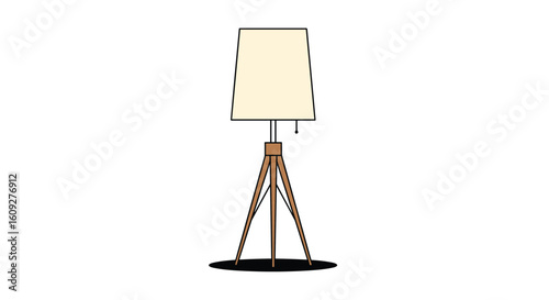 A stylish modern tripod floor lamp with a cream fabric shade and wooden legs adding a warm glow to any living room or reading nook