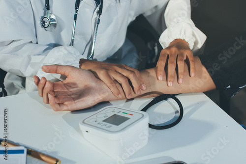 Wallpaper Mural Doctor checking patient arterial blood pressure in hospital. Health care Concept Torontodigital.ca