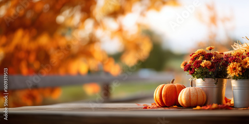 Pumpkins and colorful mums line an outdoor wooden backyard porch, framed by golden autumn leaves. The warm, rustic backdrop for harvest festivals, Thanksgiving and other seasonal events. Fall Banner