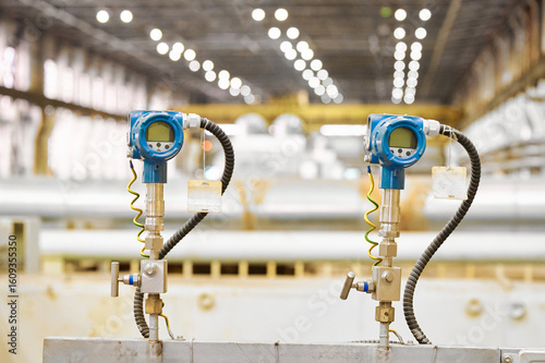 Electronic temperature sensors in a manufacturing facility showing precision instruments for monitoring environmental conditions and efficiency