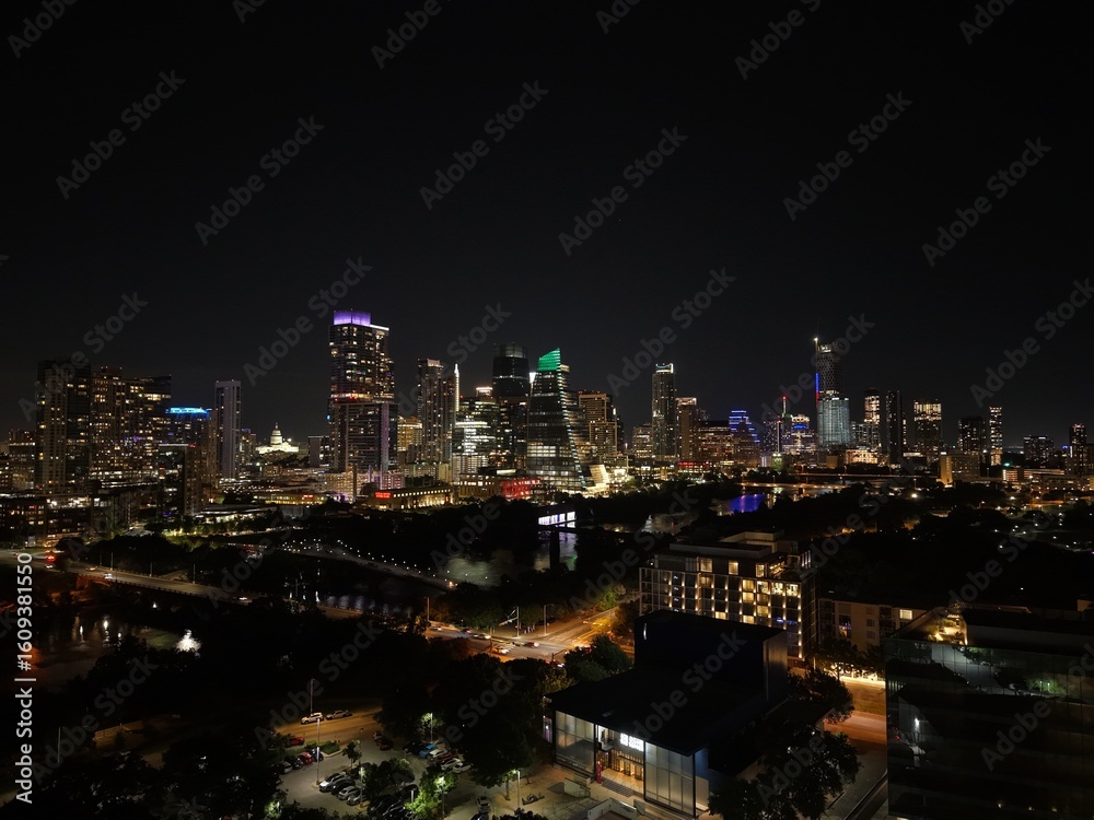 Obraz premium Beautiful Austin skyline at night with a stunning aerial drone view