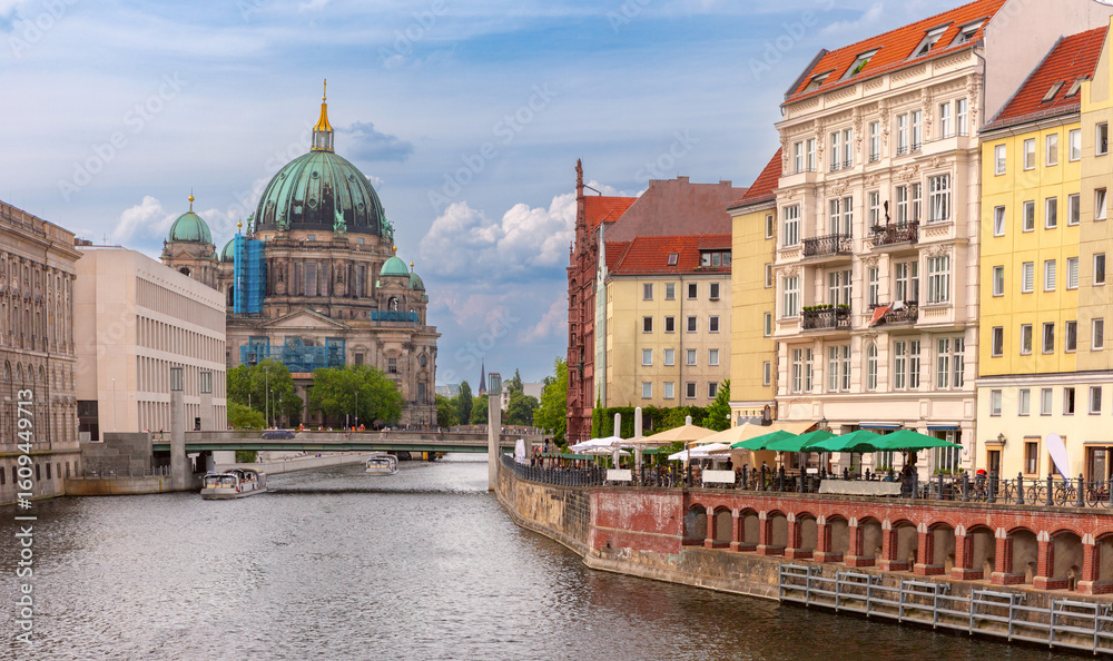 Naklejka premium View of Berlin Cathedral with dome and surrounding historic buildings along the Spree River in Berlin Germany