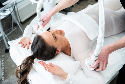Photography Woman receiving a body sculpting treatment at a wellness center