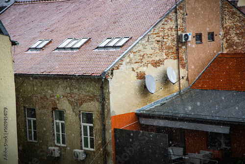 Osijek rooftops during rainstorm