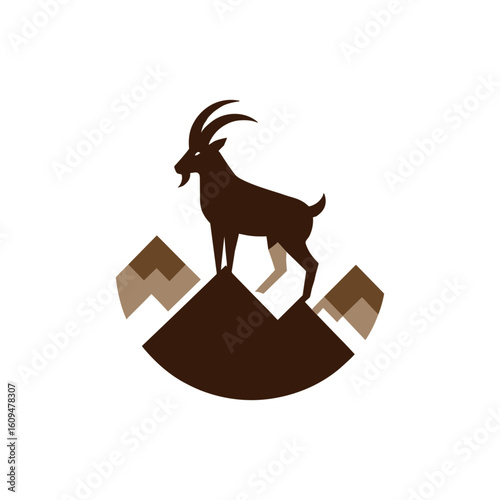 Mountain goat standing majestically on a peak, overlooking a scenic mountainous landscape