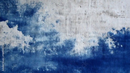 Worn indigo fading into cloudy white