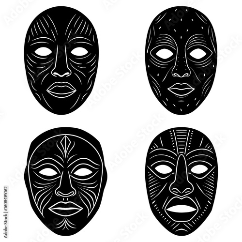 Collection of four black and white african tribal masks with unique designs and facial features shown