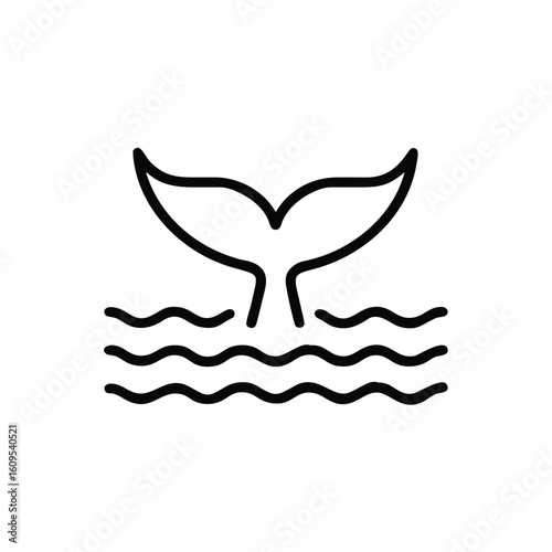 Outline whale tail emerging from wavy water on fluke ocean