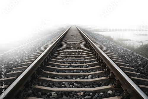 Perspective view of train tracks disappearing into fog