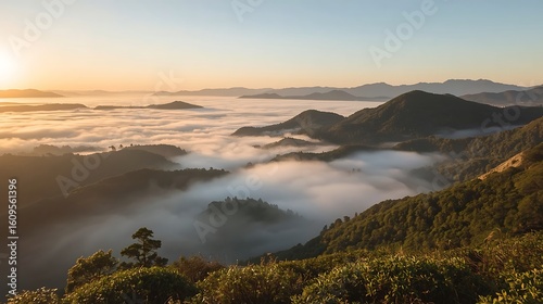 Scenic mountain landscape with sunrise and morning fog