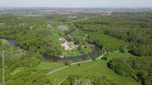 Drone video of the romantic ruins of Jan's Castle in the Lednice-Valtice area in South Moravia, Czech Republic. Aerial footage of the summer landscape, the Dyje River and the castle.