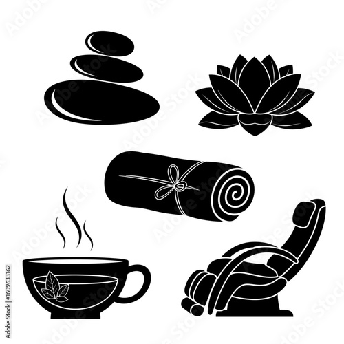 Black and white spa elements including stones lotus towel tea and chair art
