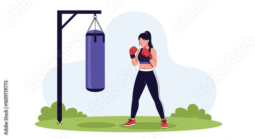 Woman practicing boxing punching bag training outdoors fitness workout activity young athlete