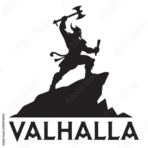 Silhouette of viking warrior with axe standing on rock valhalla text