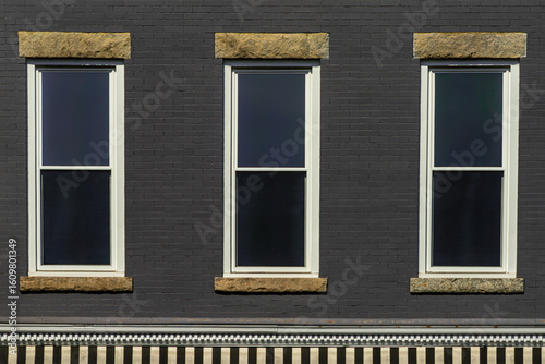 Fototapeta Naklejka Na Ścianę i Meble -  Windows on commercial building in a small town