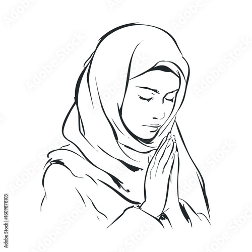 Woman wearing hijab praying in meditation for peace and spirituality