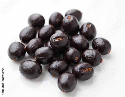 Wallpaper Mural Pile of exotic tonka beans on white background. Dark brown seeds with unique shape, showcasing natural culinary ingredient for baking, desserts, and gourmet cooking. Rich aroma, flavouring. Torontodigital.ca