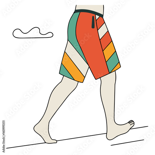 Man walking barefoot in colorful swim shorts by the beach  
