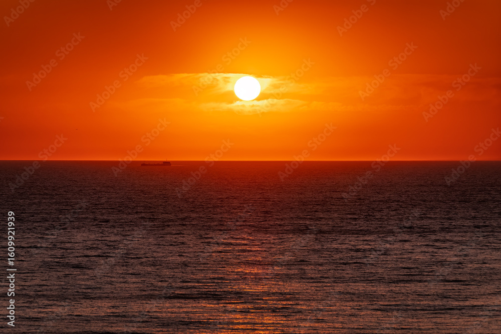 Beautiful red and orange sunrise over the sea. Beautiful red and orange sunrise over the sea.