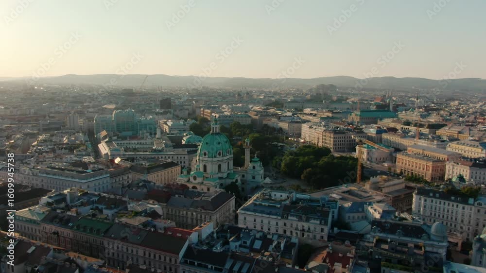 custom made wallpaper toronto digitalDrone footage of Karlskirche dome in Vienna, surrounded by classical buildings and city center streets. Perfect for travel media, heritage documentaries, or architectural features. 4K orbit shit