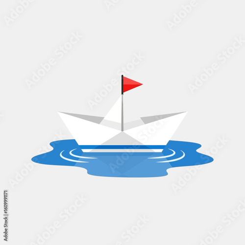 Paper boat with red flag floating on blue water against a gray background.