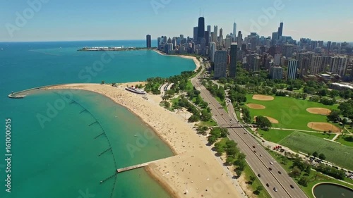 An aerial view of chicagos skyline and lakefront beach