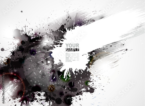 Abstract grunge background with black ink splatters and paint texture forming a decorative border