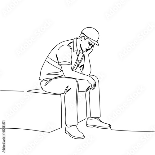 Tired construction worker sitting on block and resting his head  