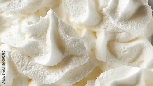 Delicate White Cream Frosting Swirls: A Sweet and Appetizing Culinary Delight closeup