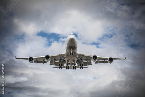Jumbo Jet Approaching Under Cloudy Sky