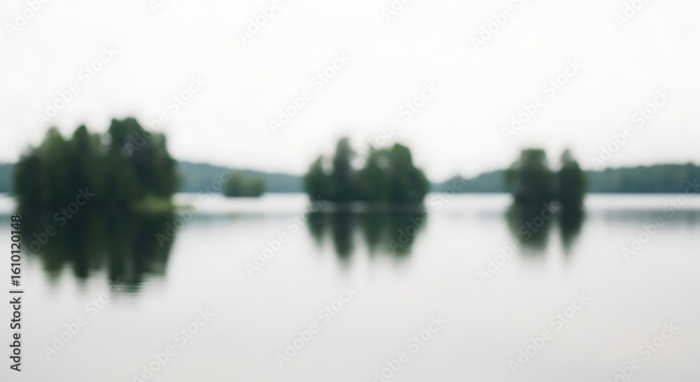 Obraz premium Serene Lake Scene with Islands Completely Blurry Landscape in Soft, Dreamlike Blur
