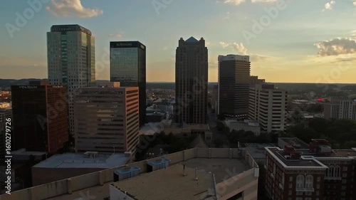 The birmingham skyline is silhouetted against the evening sky